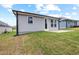 Spacious backyard featuring a cozy patio, lush lawn, and well-maintained landscaping, perfect for outdoor enjoyment at 2316 Beeblossom Pl, Fuquay Varina, NC 27526