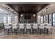 Stylish bar area with modern seating, sleek countertops, and contemporary lighting at 2316 Beeblossom Pl, Fuquay Varina, NC 27526