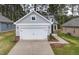 Charming home featuring a 2-car garage, a welcoming walkway, and tasteful landscaping, offering great curb appeal at 2316 Beeblossom Pl, Fuquay Varina, NC 27526