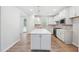 Large kitchen with a center island, stainless appliances, and white cabinetry at 2316 Beeblossom Pl, Fuquay Varina, NC 27526