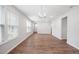 Bright living room with wood floors, neutral walls, and lots of natural light at 2316 Beeblossom Pl, Fuquay Varina, NC 27526