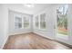 Cozy sunroom with natural light and an exterior door to the patio and yard at 2316 Beeblossom Pl, Fuquay Varina, NC 27526