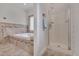 Bathroom showcasing bathtub and glass door shower with tile surround offering a spa-like experience at 2411 Lynch Store Rd, Mebane, NC 27302