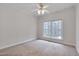 Inviting bedroom with a large window, neutral carpet, ceiling fan and ample natural light at 2411 Lynch Store Rd, Mebane, NC 27302
