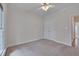 Bright bedroom featuring a ceiling fan, ample natural light and a spacious double door closet at 2411 Lynch Store Rd, Mebane, NC 27302