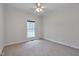 Cozy bedroom with neutral carpet and a ceiling fan, providing a comfortable and relaxing space at 2411 Lynch Store Rd, Mebane, NC 27302