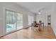 Dining room showcasing hardwood floors and a sliding glass door with access to a fenced in backyard and pool at 2411 Lynch Store Rd, Mebane, NC 27302