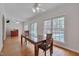 Dining room with hardwood floors, natural light and views of the backyard and pool at 2411 Lynch Store Rd, Mebane, NC 27302