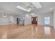 Bright living room with hardwood floors, skylights, neutral paint, open access to kitchen and front door at 2411 Lynch Store Rd, Mebane, NC 27302