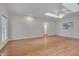 Bright living room with hardwood floors and skylights showcasing a clean, modern aesthetic and plenty of natural light at 2411 Lynch Store Rd, Mebane, NC 27302