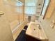 Bathroom featuring a single sink vanity, toilet, and shower/tub with glass doors at 2501 Landis Dr, Durham, NC 27705