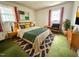 Stylish bedroom featuring natural light, modern decor, and sleek bedside tables at 2501 Landis Dr, Durham, NC 27705