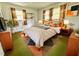 Cozy bedroom featuring a comfortable bed, bedside tables, and eye-catching decor at 2501 Landis Dr, Durham, NC 27705