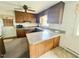 Kitchen featuring wood cabinets, granite countertops, and stainless steel appliances at 2501 Landis Dr, Durham, NC 27705