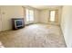 Spacious living room featuring neutral carpet and multiple windows offering natural light at 2501 Landis Dr, Durham, NC 27705