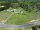 This is an aerial view of a property featuring a home with a sprawling lawn and tree-lined surroundings at 2651 Bennett Rd, Creedmoor, NC 27522