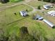 This is an aerial view of a property featuring a home, sheds and outbuildings at 2651 Bennett Rd, Creedmoor, NC 27522