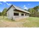 A long, narrow barn with multiple stalls and a metal roof at 2651 Bennett Rd, Creedmoor, NC 27522
