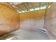 Empty wood-paneled barn stall with dirt floor at 2651 Bennett Rd, Creedmoor, NC 27522