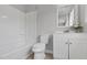 Bathroom with white shower and bath, toilet, and vanity with sink and cabinet at 2651 Bennett Rd, Creedmoor, NC 27522
