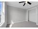 Bedroom featuring neutral walls, a ceiling fan, a closet and gray carpet at 2651 Bennett Rd, Creedmoor, NC 27522