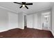 Spacious bedroom featuring two closets, ceiling fan and entry to the bathroom at 2651 Bennett Rd, Creedmoor, NC 27522