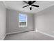 Bedroom featuring neutral walls, a ceiling fan, a window and gray carpet at 2651 Bennett Rd, Creedmoor, NC 27522