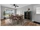 Charming dining room with wood floors, lots of natural light, a green cabinet, and stylish decor at 2651 Bennett Rd, Creedmoor, NC 27522