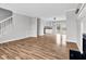 Spacious living room featuring hardwood floors, a fireplace, and seamless transition to the kitchen at 2651 Bennett Rd, Creedmoor, NC 27522