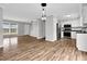 Open floor plan living room and kitchen featuring new hardwood floors at 2651 Bennett Rd, Creedmoor, NC 27522