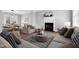 Inviting living room with a fireplace, lots of natural light and stylish, modern decor at 2651 Bennett Rd, Creedmoor, NC 27522