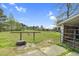 Fenced pasture with gate and water trough at 2651 Bennett Rd, Creedmoor, NC 27522