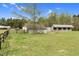 This is a charming property with a horse barn, set on a lush green lawn at 2651 Bennett Rd, Creedmoor, NC 27522