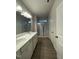 Large bathroom with double sinks, shower, and wood-look flooring at 291 Deodora Ln, Cameron, NC 28326