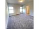 Carpeted bedroom with natural light from two windows and a view of doorway at 291 Deodora Ln, Cameron, NC 28326