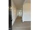 Inviting entryway featuring wood-look floors and decorative wainscoting leading into the house at 291 Deodora Ln, Cameron, NC 28326