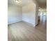 A spacious and open living room showcases the beautiful floors and neutral walls at 291 Deodora Ln, Cameron, NC 28326