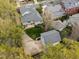 Bird's eye view of a home's backyard and driveway, surrounded by lush trees and greenery at 30079 Britt, Chapel Hill, NC 27514