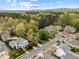 An aerial view showing the layout of homes in a suburban neighborhood with mature trees at 30079 Britt, Chapel Hill, NC 27514