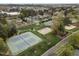 Aerial view of community amenities including tennis courts, basketball court, volleyball court, and ample green space at 30079 Britt, Chapel Hill, NC 27514