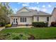 Well-maintained backyard with lush lawn, mature shrubs, and access to the home's outdoor features at 30079 Britt, Chapel Hill, NC 27514