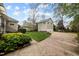 Spacious backyard with a well-maintained lawn and large driveway leading to a detached garage at 30079 Britt, Chapel Hill, NC 27514
