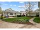 Well-manicured lawn in backyard featuring mature landscaping, a patio, and a traditional-style home at 30079 Britt, Chapel Hill, NC 27514