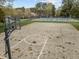 Community basketball court with a full court, basketball hoop, and a tennis court in the background at 30079 Britt, Chapel Hill, NC 27514