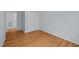Cozy bedroom with neutral walls, hardwood floors, and closet, ideal for comfortable living at 30079 Britt, Chapel Hill, NC 27514