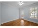 Well lit bedroom featuring hardwood floors, a window and a door at 30079 Britt, Chapel Hill, NC 27514