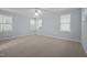 Spacious bedroom with large windows allowing for plenty of natural light and comfortable carpet flooring at 30079 Britt, Chapel Hill, NC 27514