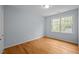 Bright bedroom features ample natural light and hardwood floors, creating a serene atmosphere at 30079 Britt, Chapel Hill, NC 27514