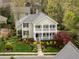 Charming two-story home with a double front porch, beautifully landscaped yard, and vibrant greenery at 30079 Britt, Chapel Hill, NC 27514