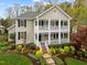 Charming two-story home with a double front porch and professionally landscaped front yard at 30079 Britt, Chapel Hill, NC 27514